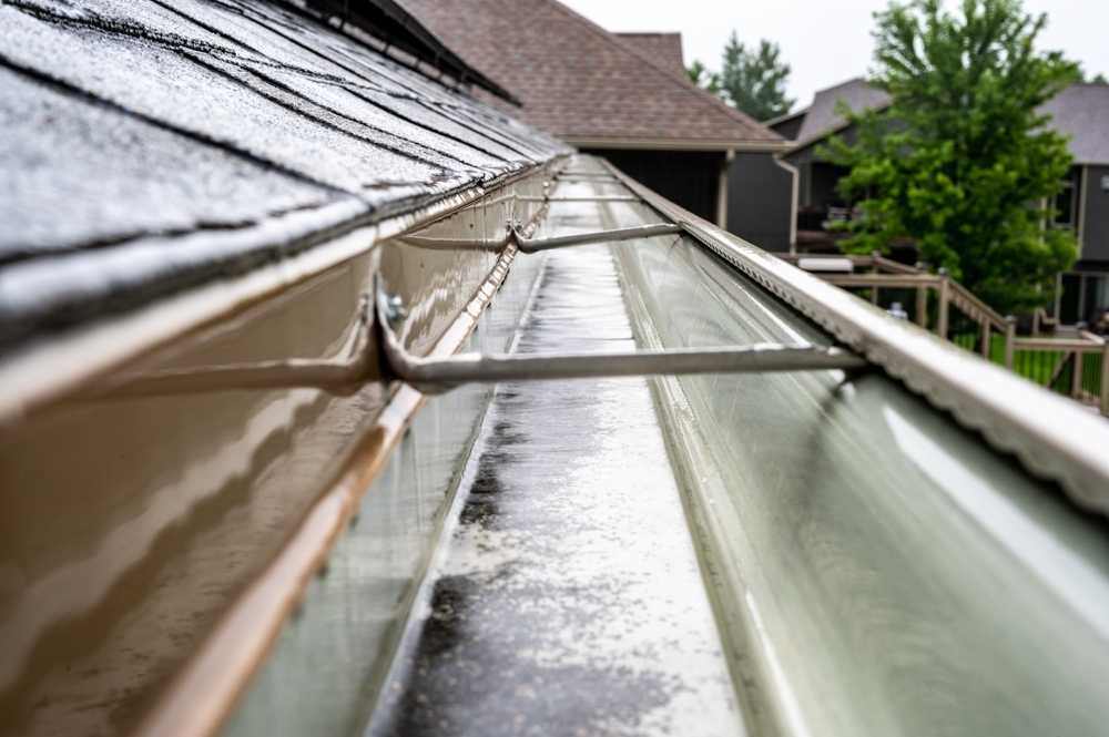 Gutter maintenance and downspout clearing